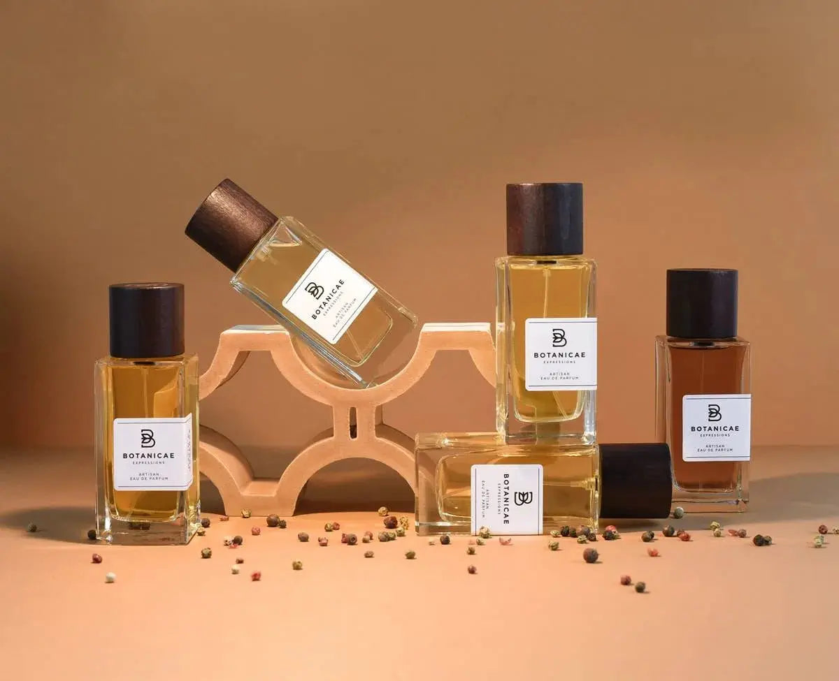 Set of perfume bottles with visible brand label on a brown background